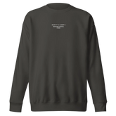 Unisex Sweatshirt in Vintage Black (verwaschenes Schwarz) mit weißen, gestickten Koordinaten und 'Maison Lourell Paris' Schriftzug auf der Brust.